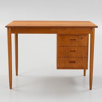 A teak-veneered desk, mid 20th century.