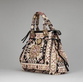 A handbag by Gucci.