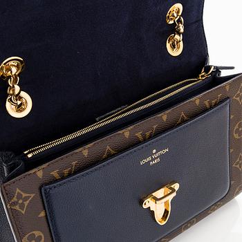 Louis Vuitton, a Monogram 'Victoire' bag.