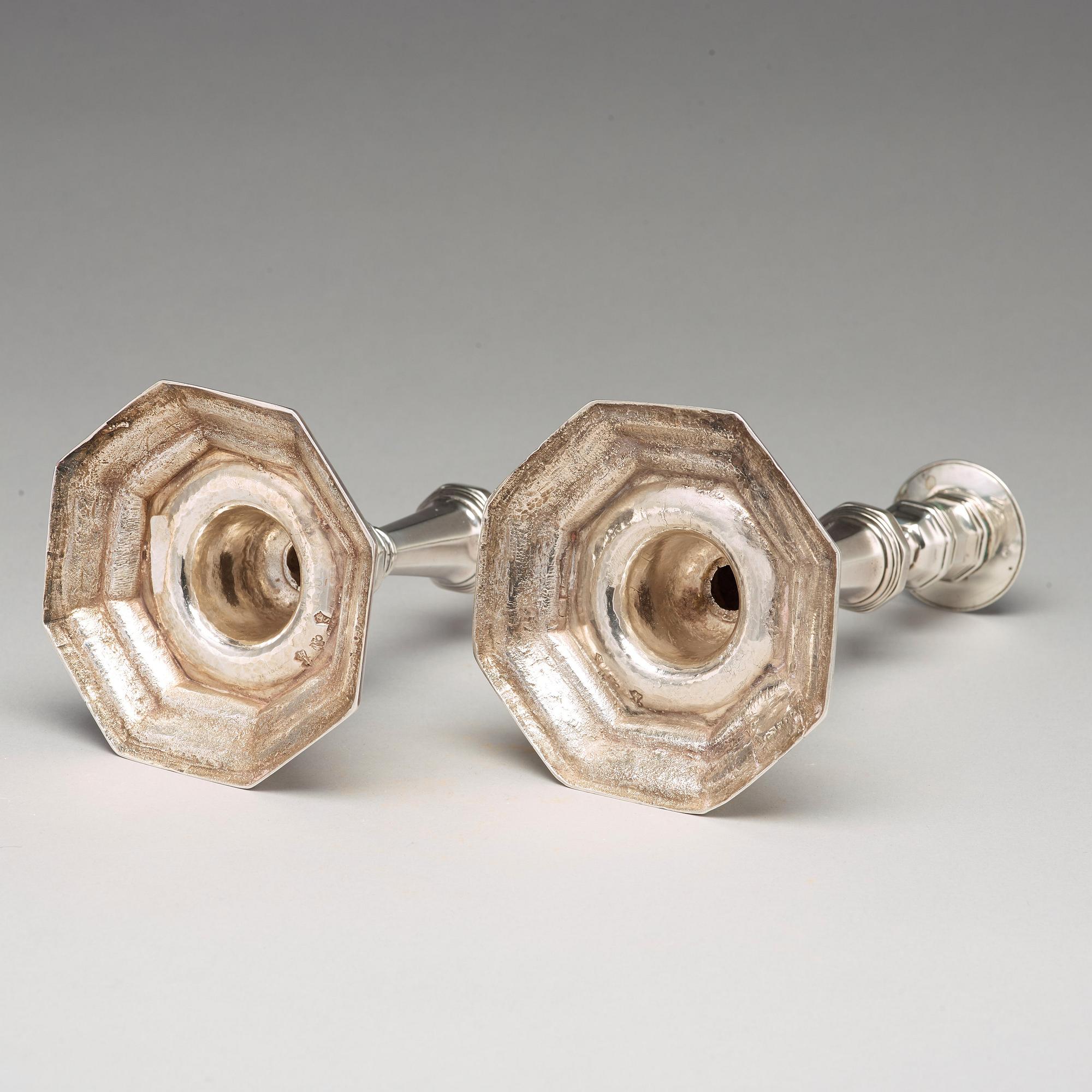 A pair of European 18th century silver candlesticks, unidentified makers mark.