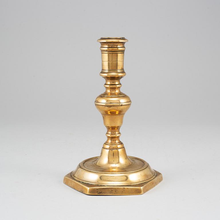 A 17th century bronze candlestick.