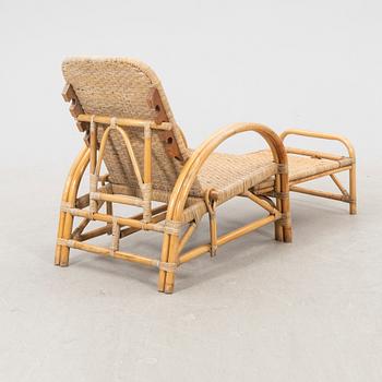 A mid 1900s rattan and bamboo garden chair.
