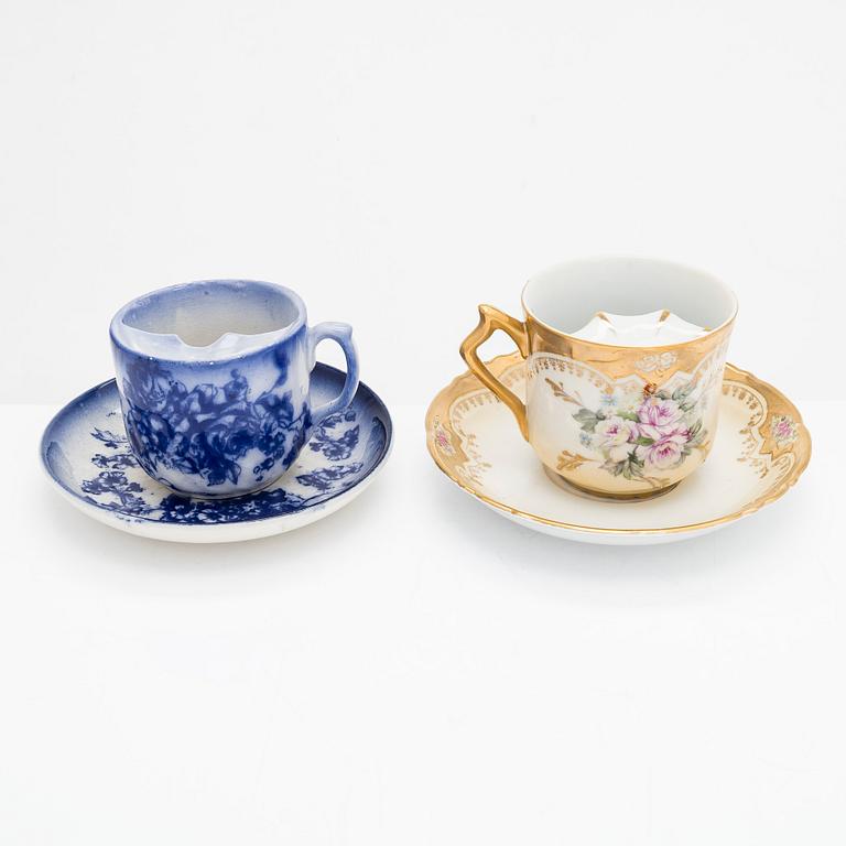 A set of 12 pair of porcelain mustache cups, including Germany, 19th and 20th century.