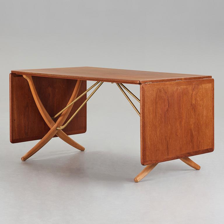 Hans J. Wegner, a teak, beech and brass dining table, model "AT-314", for Andreas Tuck, Denmark 1950-60's.