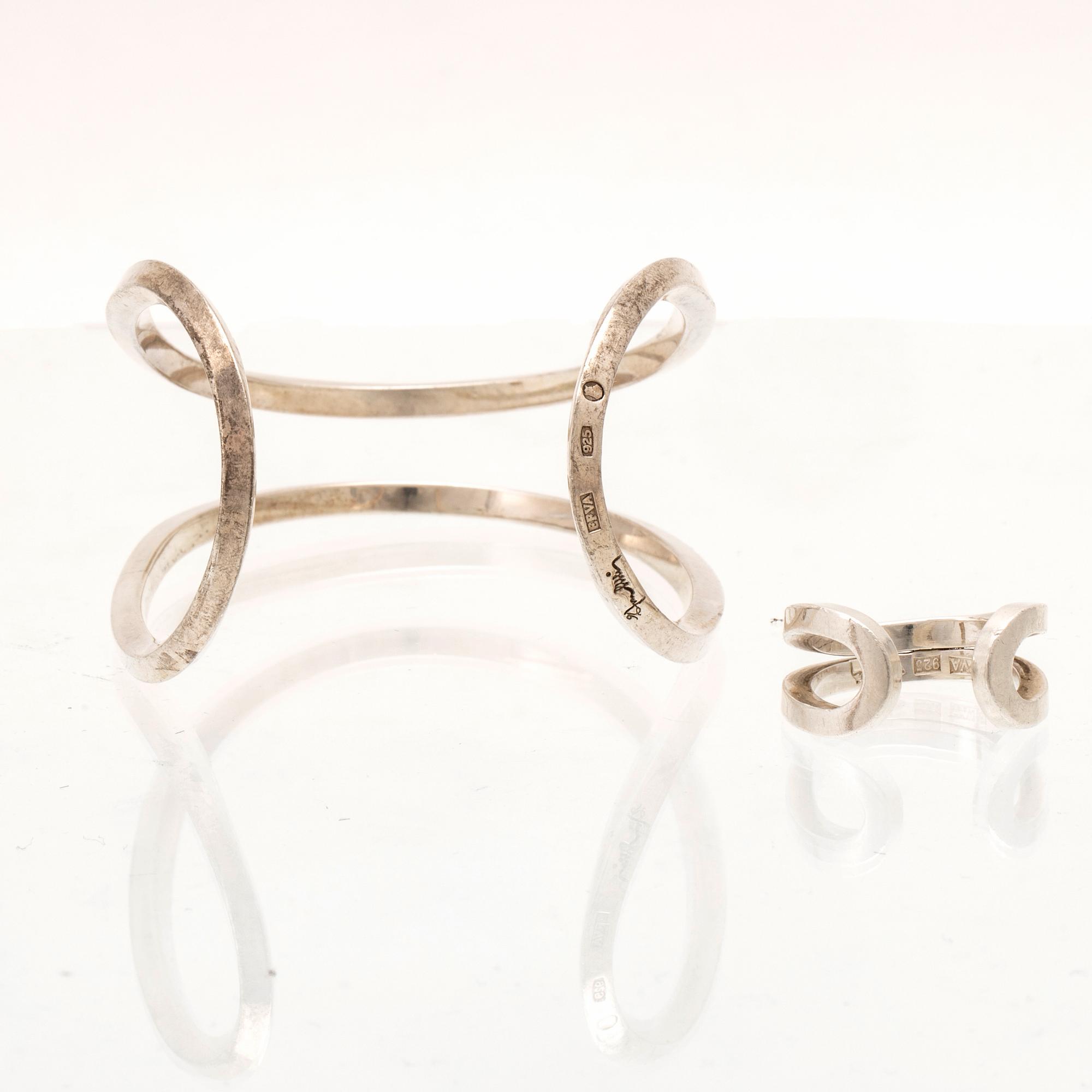 A silver ring and bracelet "loop cuff" by Efva Attling.