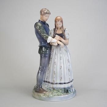 A porcelain figurine of a boy and girl model 3171 Royal Copenhagen.