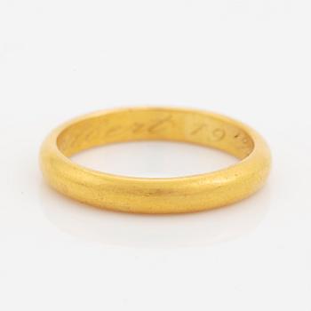 23K gold ring.