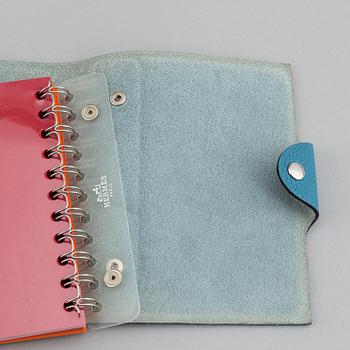 Hermès, a blue leather notebook with two scripple pads.