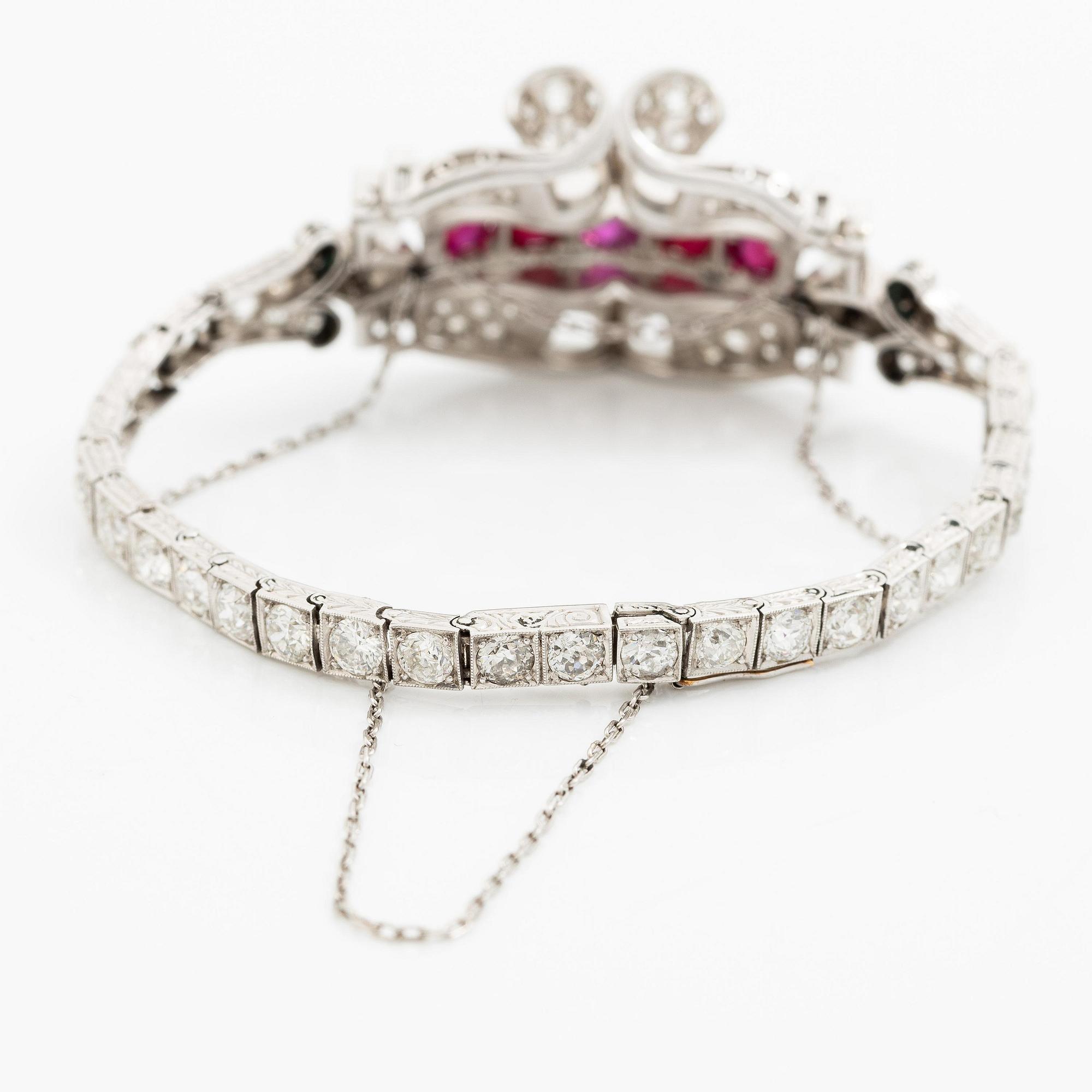 A bracelet platinum set with old- and baguette-cut diamonds and cabochon-cut rubies, circa 1930-40s.
