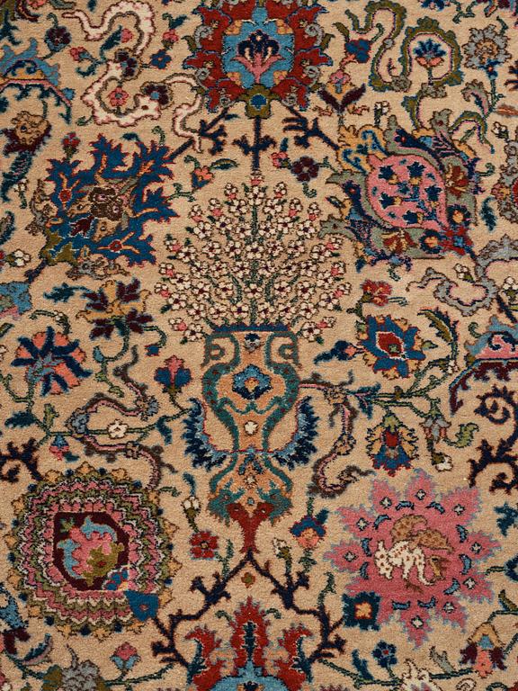 A RUG, a semi-antique Tabriz, ca 198 x 142 cm.