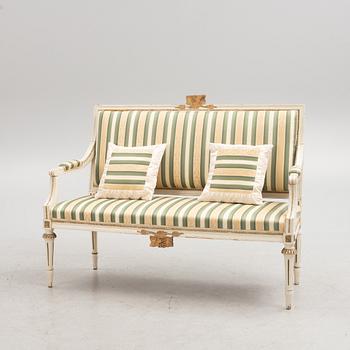 A Gustavian style sofa, early 20th century.