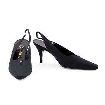 400. CHANEL, a pair of black satin slingbacks.