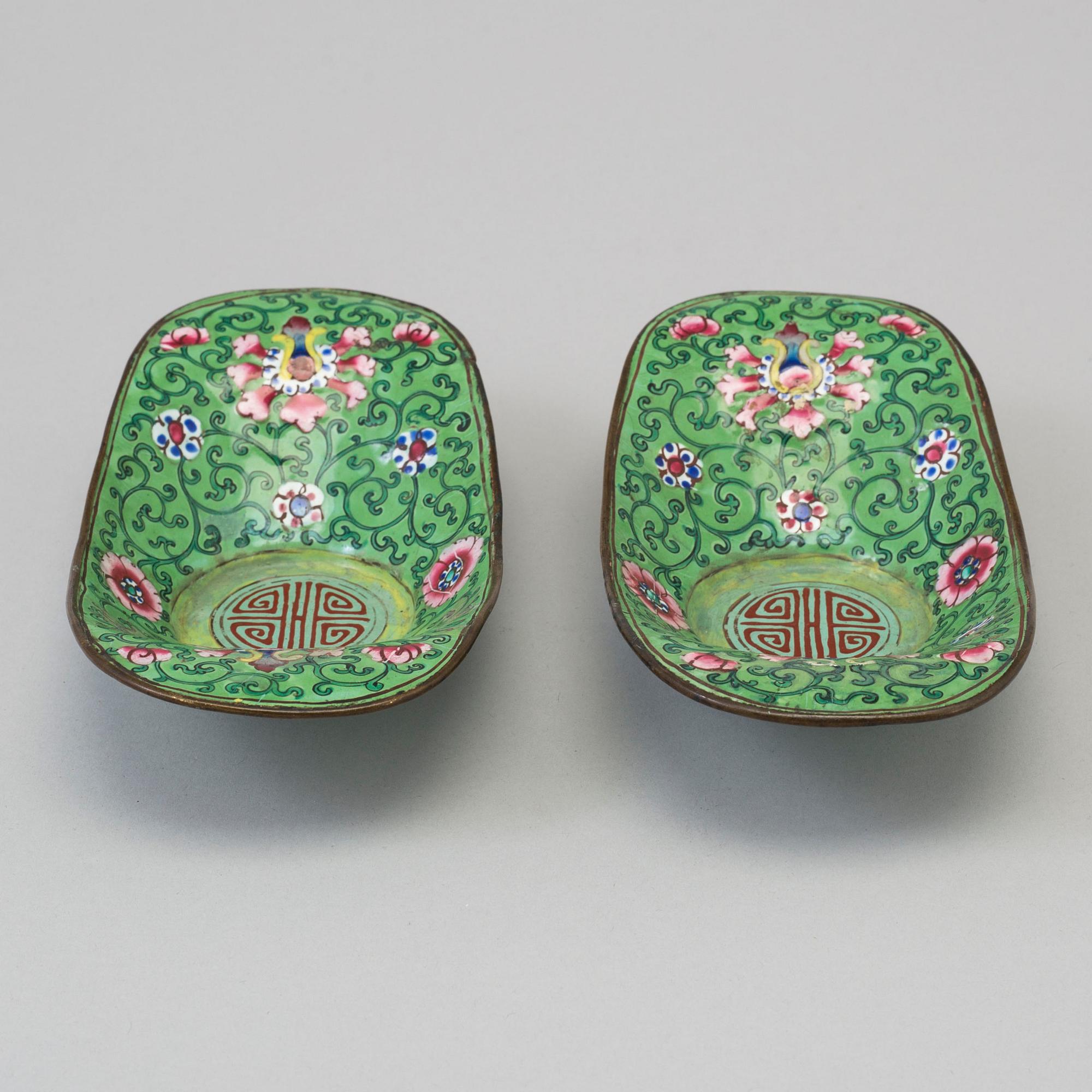 A pair of circa 1900 Qing dynasty enamel saucers.