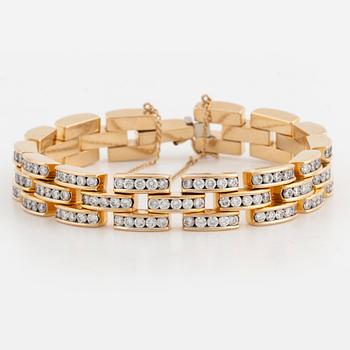 18K gold and brilliant-cut diamond bracelet.