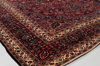 A carpet, semi-antique Mashad/Moud, ca 292 x 214 -218 cm.