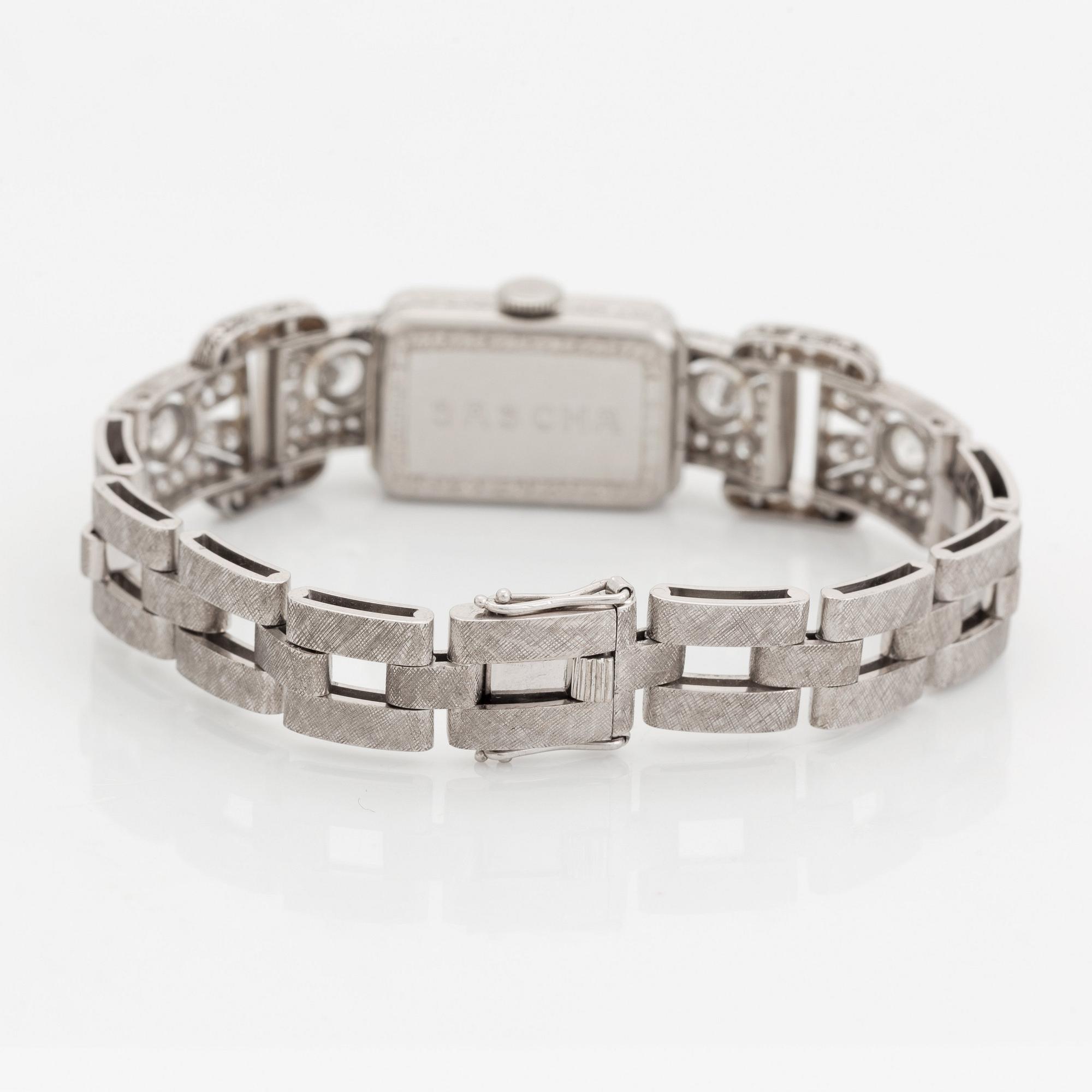 A bracelet/watch in platinum and 18K white gold set with old- and eight-cut diamonds.