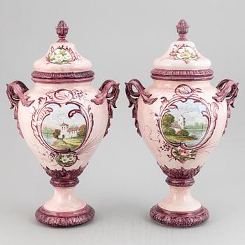 A pair of earthenware vases with covers, early 20th century.