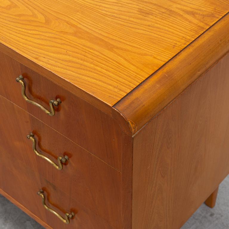 An elm wood venered chest of drawers mid 20th century.