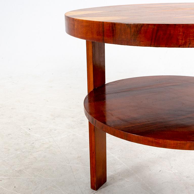 A veneered table from the first half of the 20th century.