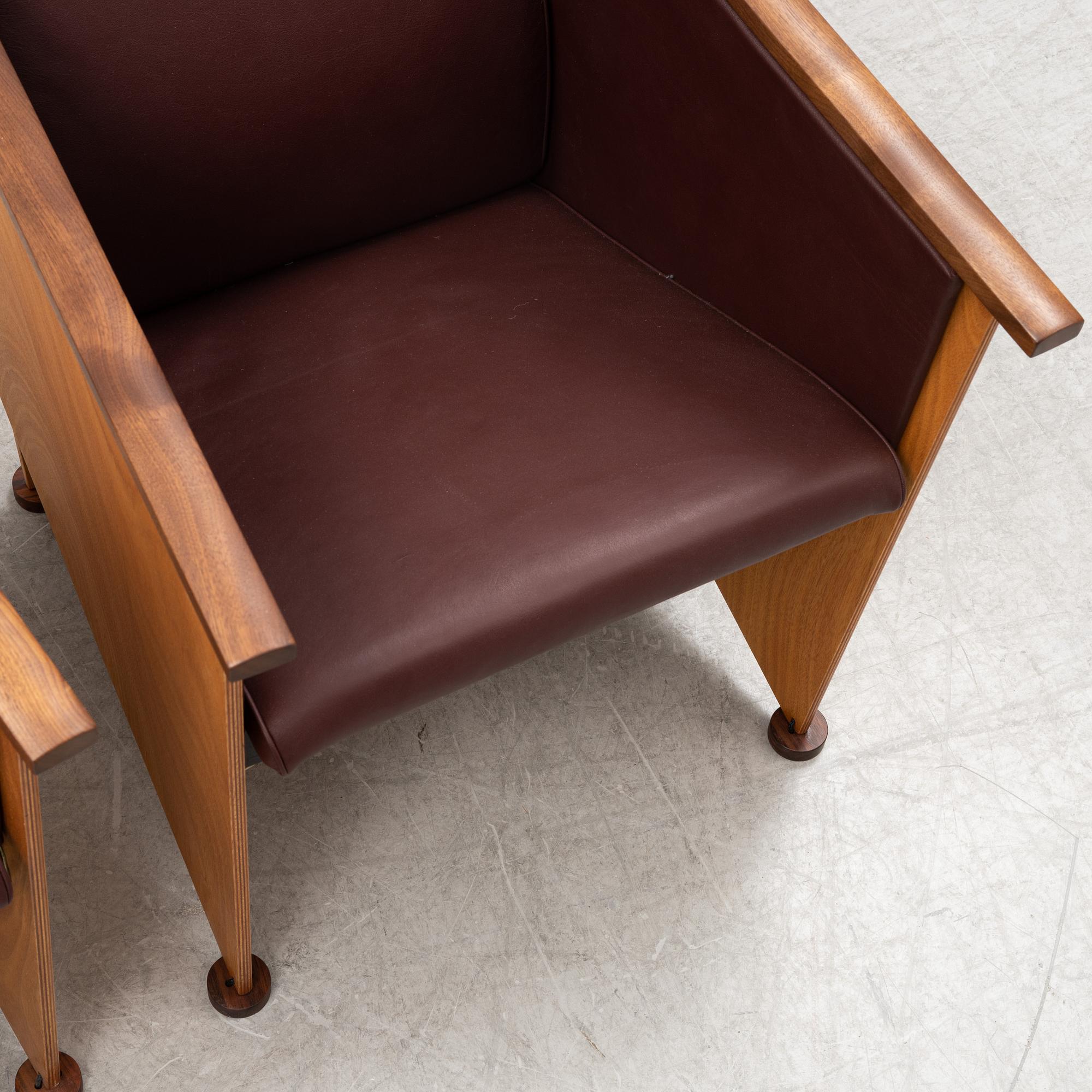 Torbjörn Ahlström, a pair of mahogany and cherry armchairs.
