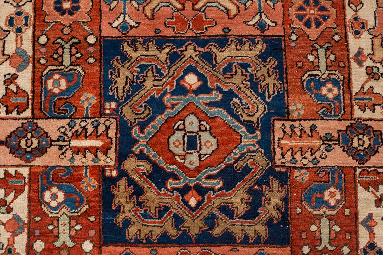 A carpet, antique Heriz, ca 334 x 271-276 cm ( ca 1-4 cm flat weave at the ends).