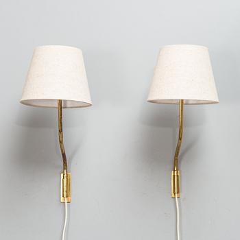 Lisa Johansson-Pape, Two mid-20th century '3053' wall lights for Stockmann Orno.