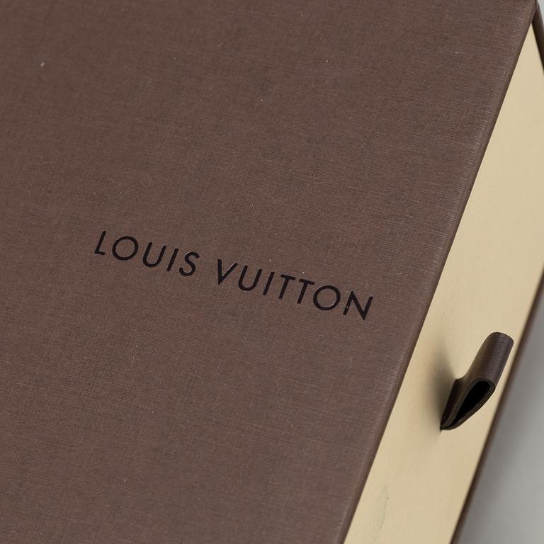 A belt by Louis Vuitton.