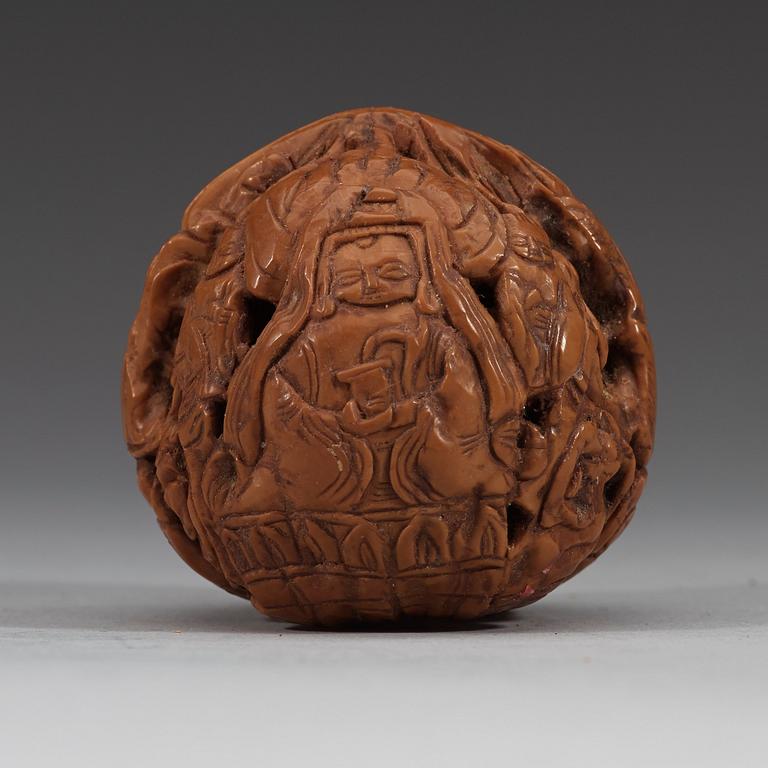 A set of six carved walnut hand exercisers, late Qing dynasty (1644-1912).