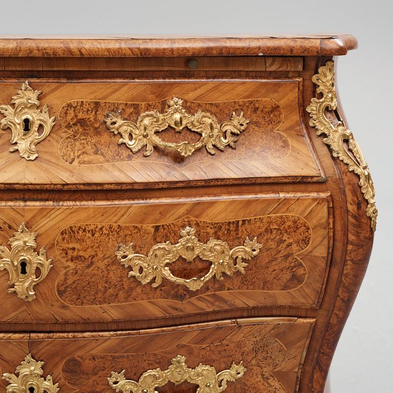 A burr-alder and gilt brass-mounted rococo commode by J. Sjölin (master 1767-1785).