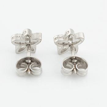 Ole Lynggaard a pair of earrings in the shape of flowers.
