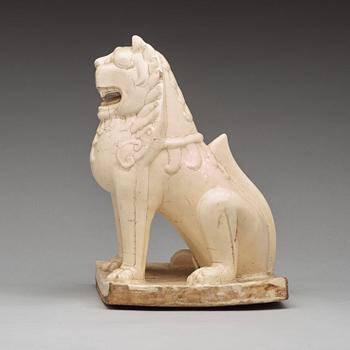 A white glazed seated mythical beast, Qing dynasty, presumably Kangxi (1662-1722).