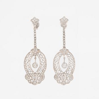 Platinum earrings with brilliant-cut and octagon-cut diamonds.