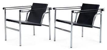 A pair of Le Corbusier 'LC 1' black leather  and chromed steel armchairs, Cassina, Italy.