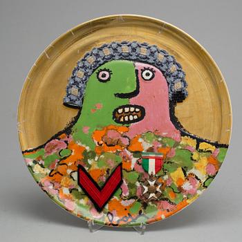 An Enrico Baj porcelain plate with garter and medals, "L'Ultimo dei Generali", Ceramica Franco Pozzi, numbered 682/3000.