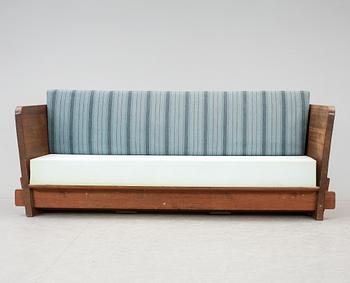 An Axel Einar Hjorth 'Lovö' stained pine sofa, Nordiska Kompaniet, Sweden 1930's.