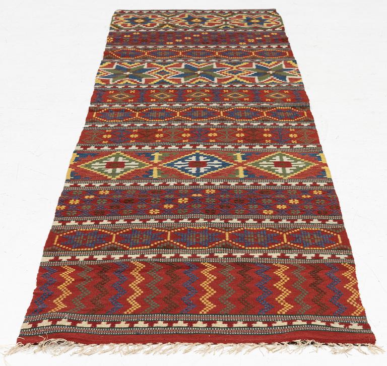 A bench cushion, flat weave, c. 262 x 64 cm, Scania, around the year 1900.