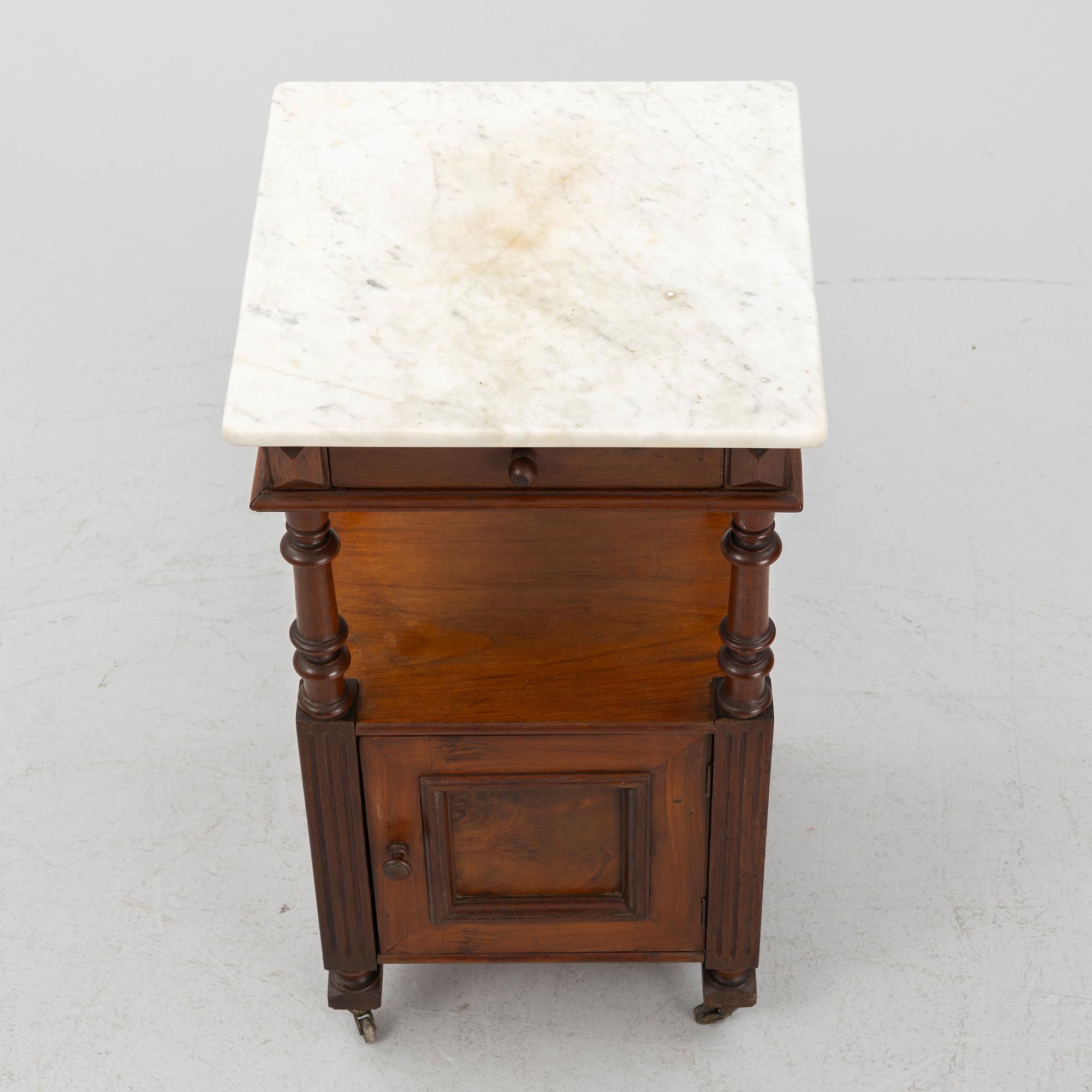 An early 20th century bedside table.