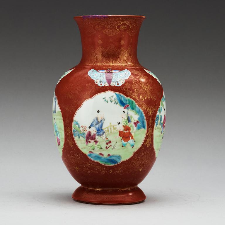 A coral ground famille rose vase, Qing dynasty.
