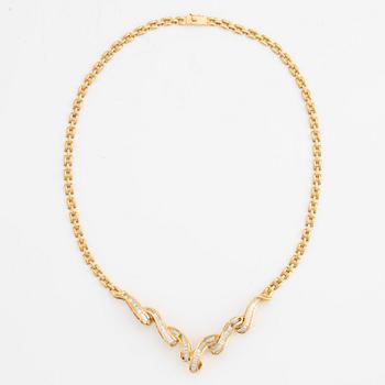 Necklace, 18K gold with baguette-cut diamonds.