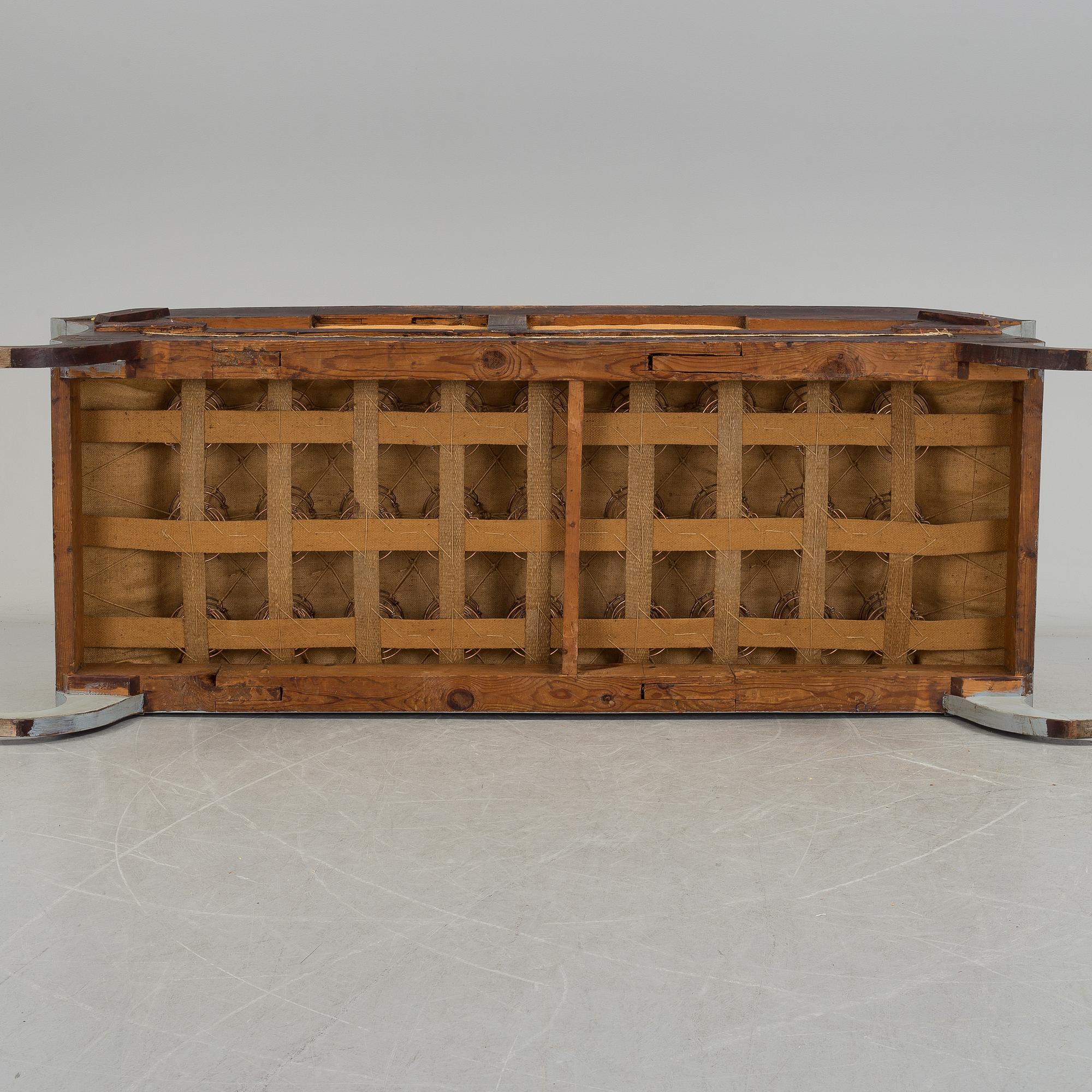 A mid 19th century painted sofa.