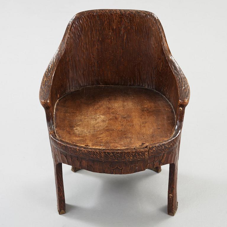 A Gustav Fjaestad Art Nouveau carved pine chair, 'Stabbestol', by Adolf Swanson, Arvika, Sweden 1908.