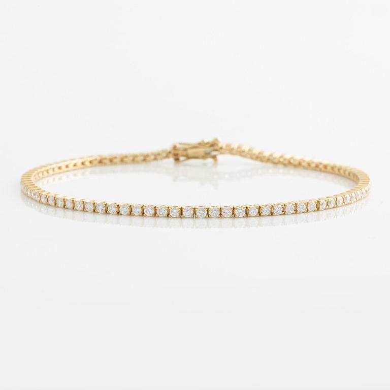 Tennis bracelet, 14K gold with brilliant-cut diamonds.