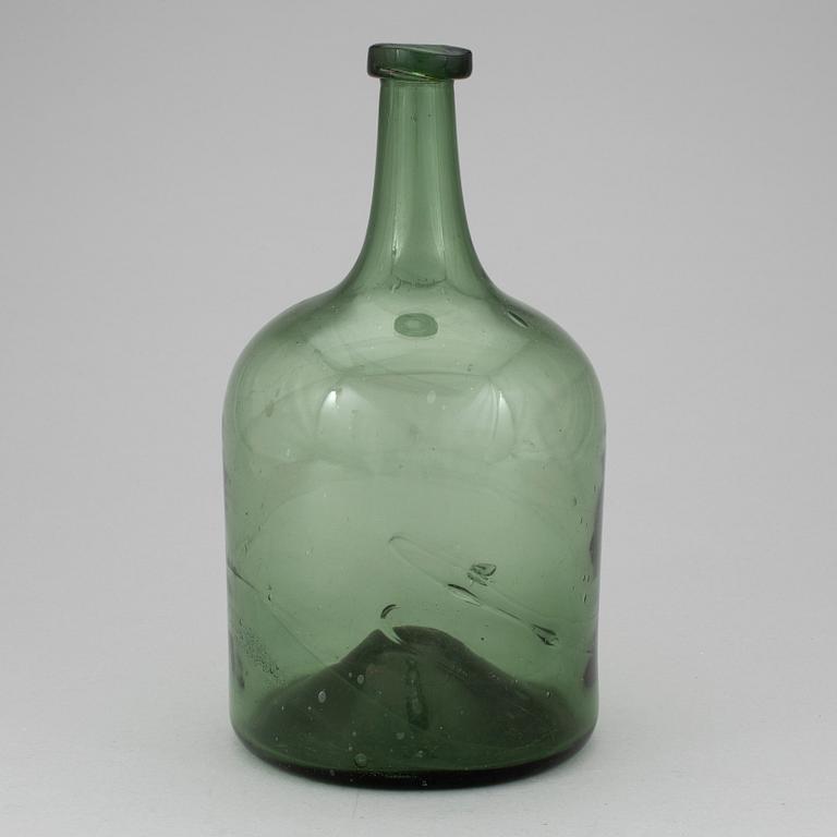 A 18th or 19th century glass bottle.