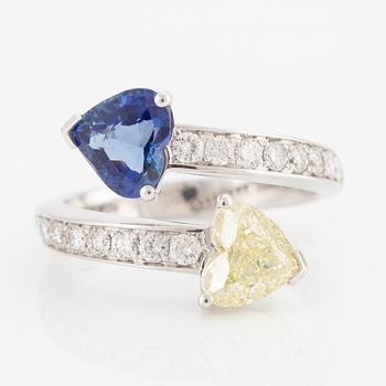 Ring, 18K white gold with a heart-shaped yellow diamond and sapphire, accompanied by GIA report.