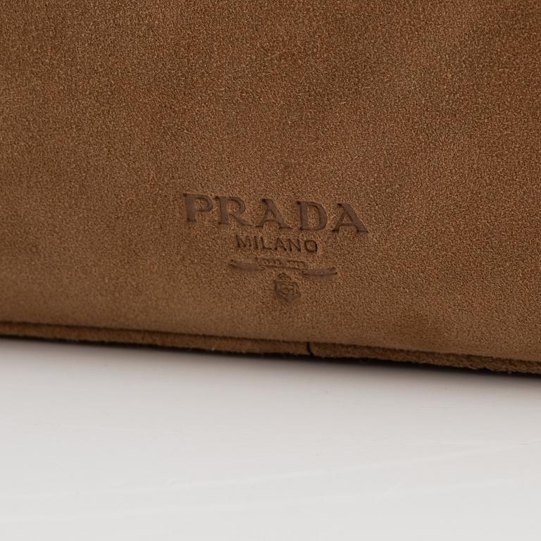 Prada, a tan suede bag.