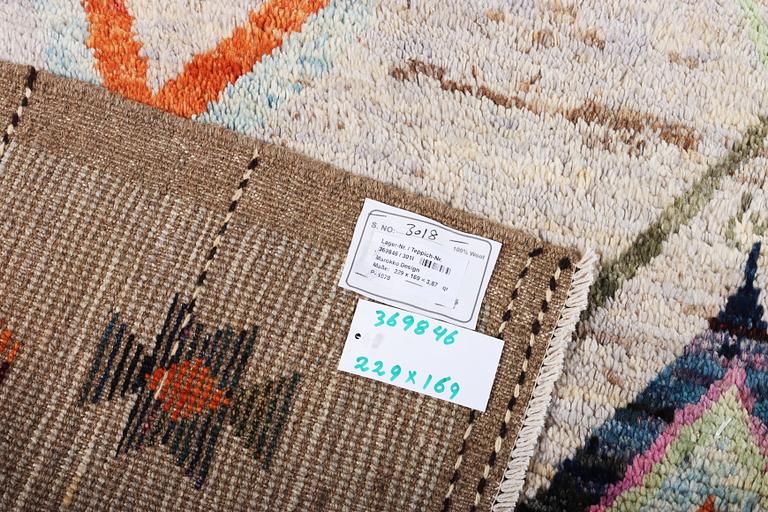 A Moroccan rug, c. 229 x 169 cm.