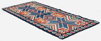A flat weave carriage cushion, c. 116 x 48 cm, Färs district, Southwest Scania, Sweden, first part of the 19th century.