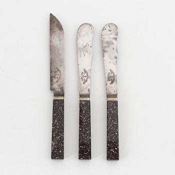 Three porphyry and steel knives, circa 1900.