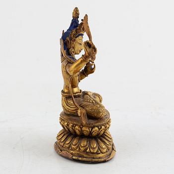 A gilt bronze figure of Manjushri, 20th century.