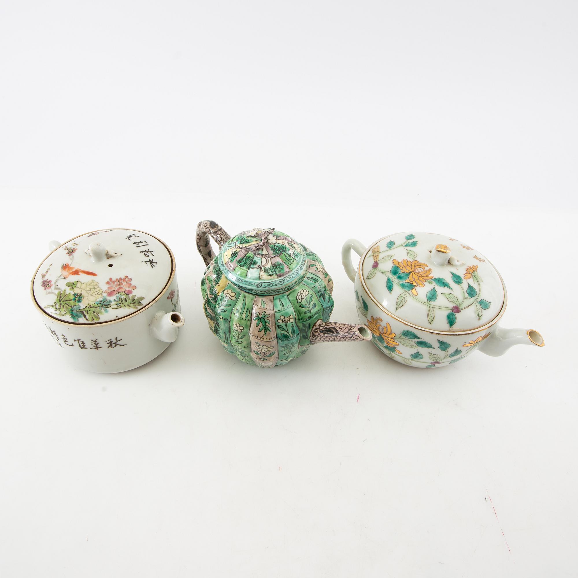 A set of three differently decorated tea pots with covers, Qing dynasty, 18century and 20th century.